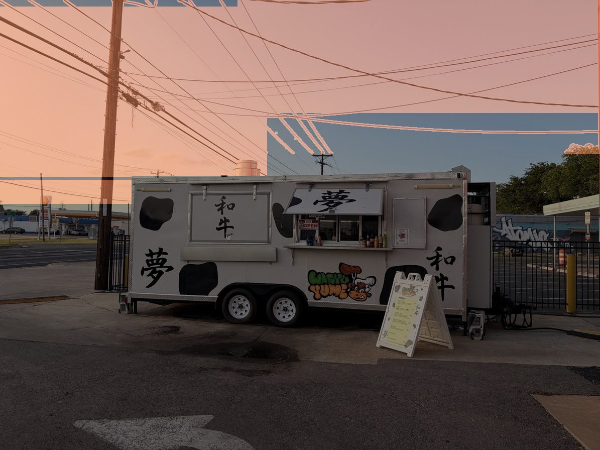 The mask laid over the photograph in amber, covering the sky and the wires while the truck, the forecourt and the buildings stay dark.